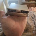 Aurzen ZIP Tri-Fold DLP Truly Mini Projector. Pocket Size. Zero-Lag Focus. One-Click Screen Mirroring. Full-Screen Mode. Type-C Fast Charging. 5.000mAh Battery. Indoor Outdoor Portable Projector.Gold